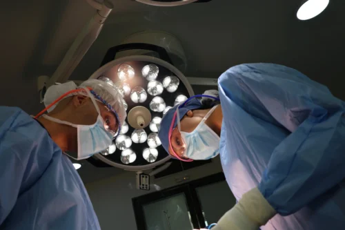 Dr. Stephania Pinedo, board-certified plastic surgeon performing a Deep Plane Facelift in Bogota.